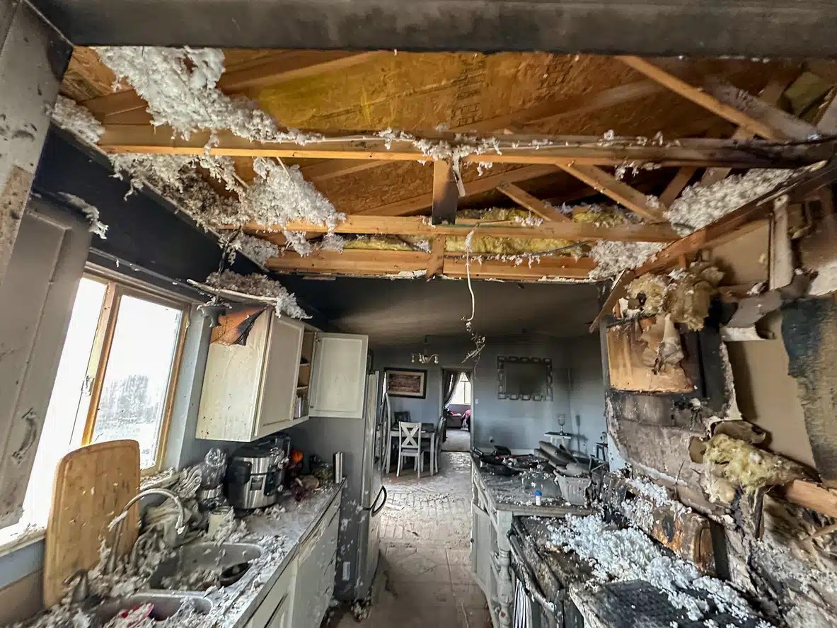 Fire-damaged kitchen requiring cleanup and restoration